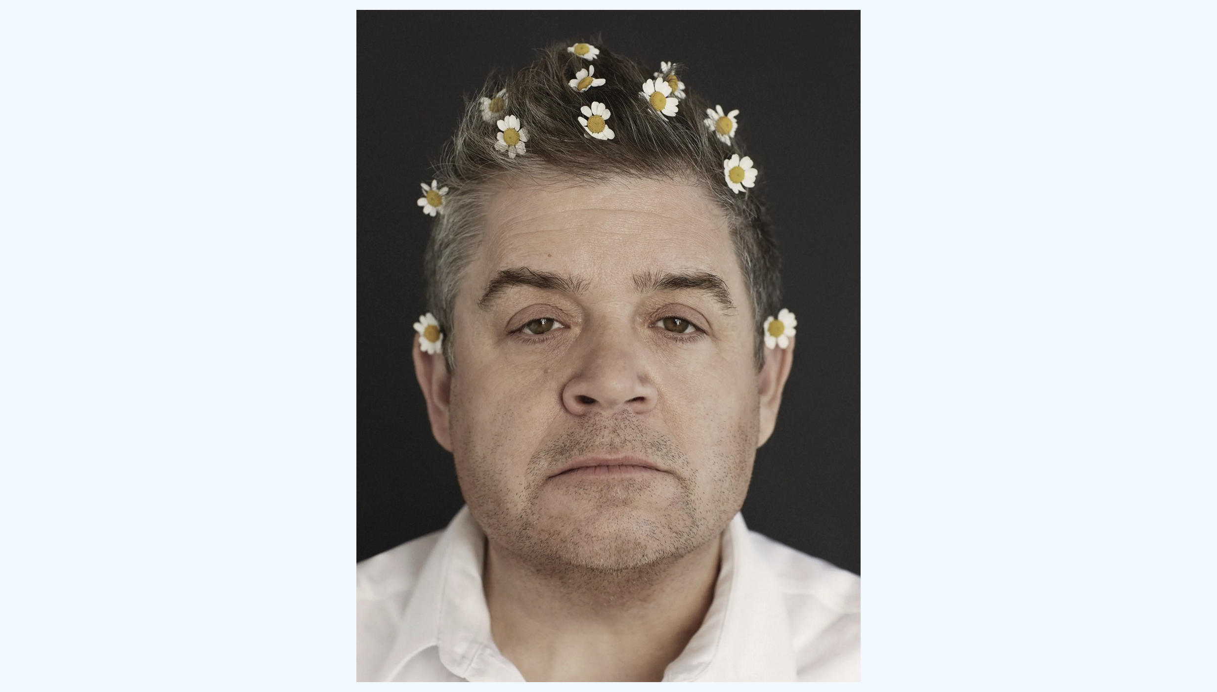 Comedian Patton Oswalt with flowers in his hair